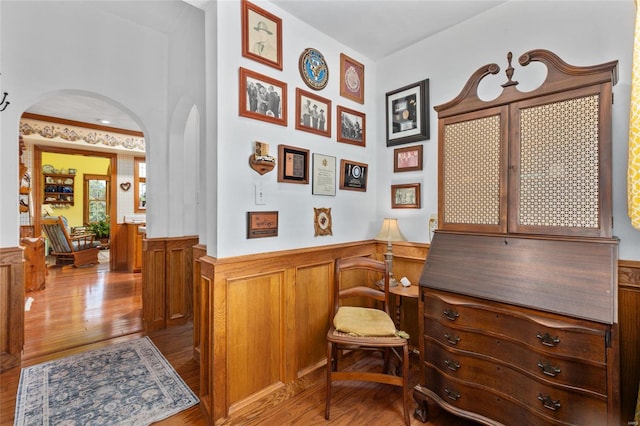 corridor with light hardwood / wood-style floors