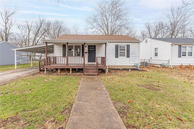 view of front of home featuring central AC, covered porch, and a front lawn