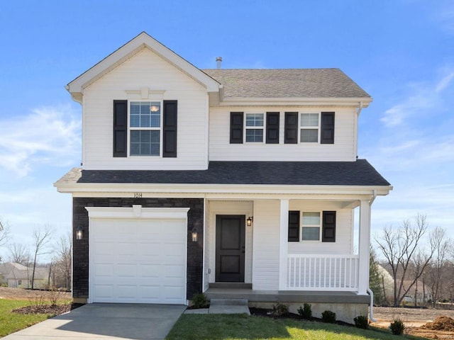 view of front of property with a porch and a garage