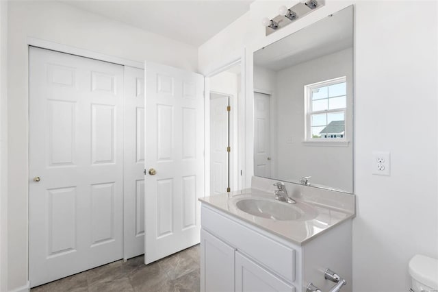 bathroom with vanity and toilet