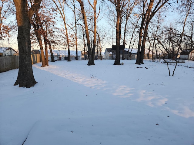 view of yard layered in snow