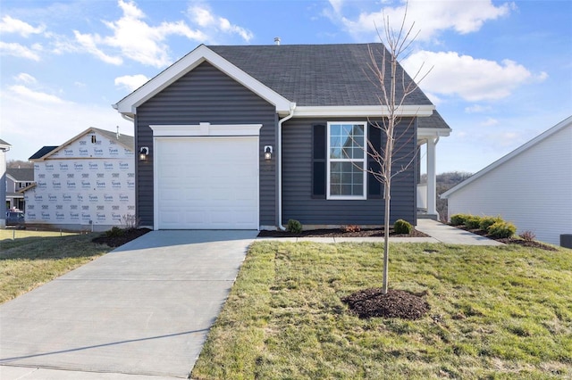 ranch-style home with a front lawn and a garage