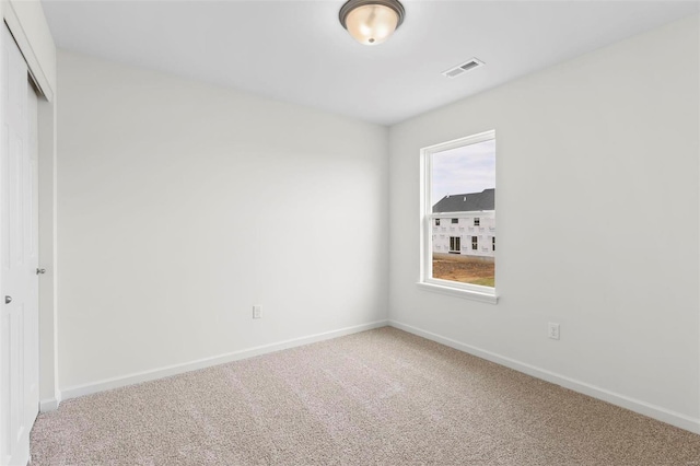 unfurnished room with carpet floors