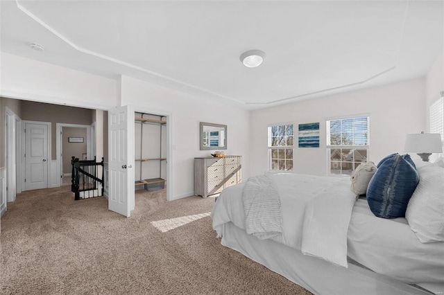 carpeted bedroom with baseboards