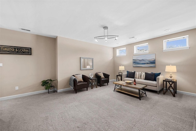 carpeted living room with baseboards and visible vents