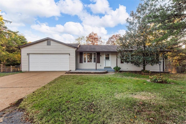 ranch-style home with a garage and a front lawn