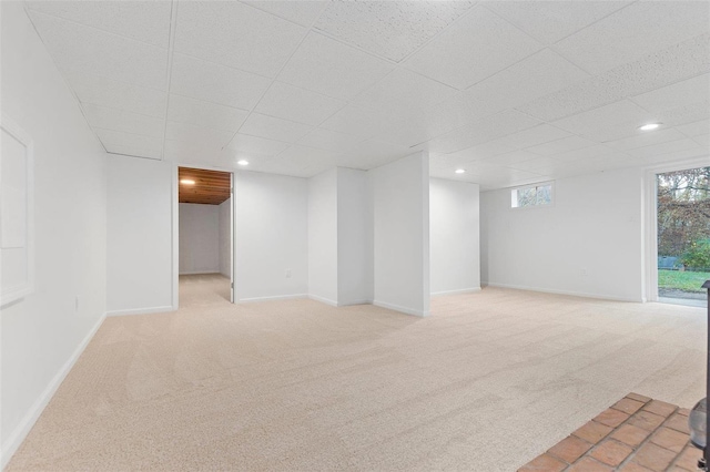 basement with light colored carpet