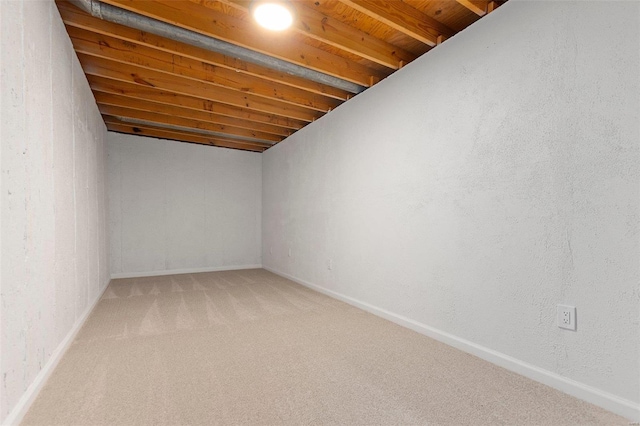 basement featuring carpet flooring