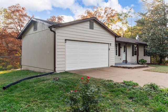 view of front facade with a front lawn and a garage