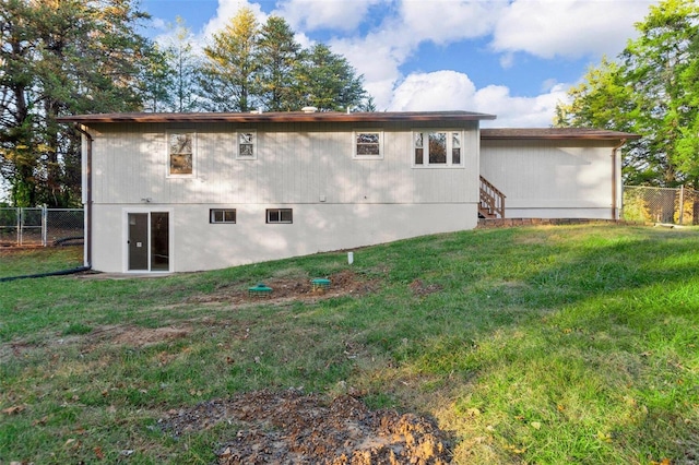 view of home's exterior with a lawn