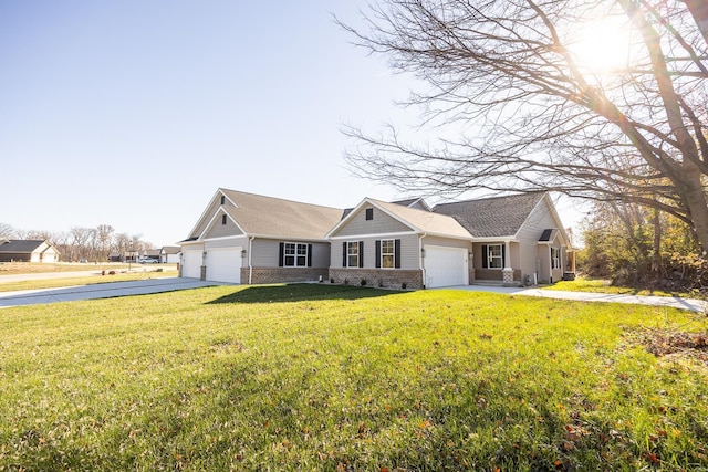 single story home featuring a front lawn and a garage