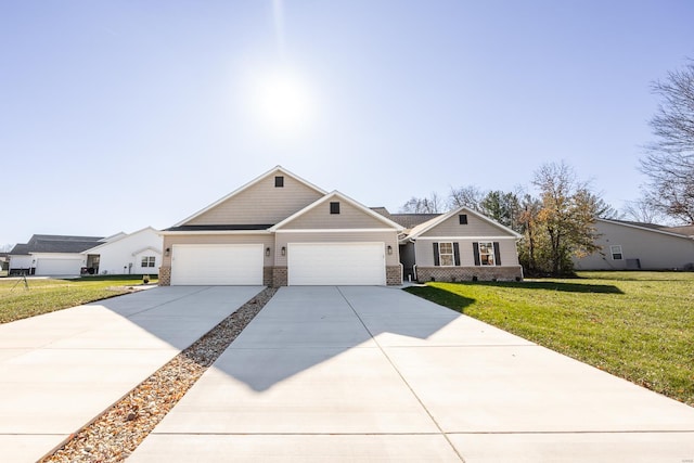 view of front of home featuring a front yard and a garage