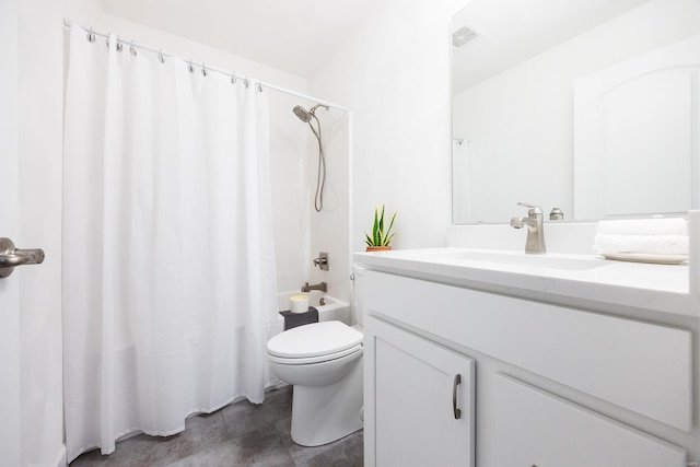 full bathroom featuring shower / bath combo with shower curtain, vanity, and toilet