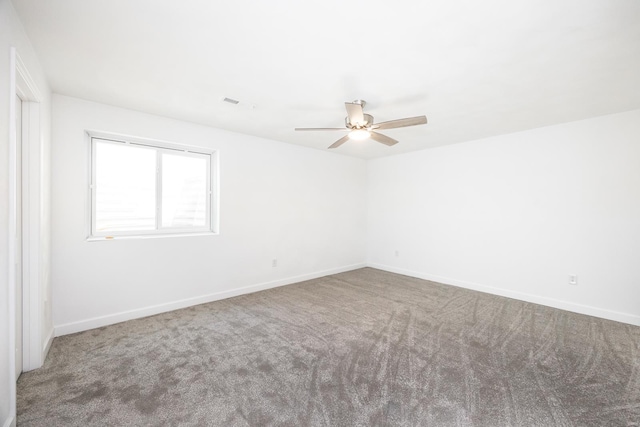 spare room with ceiling fan and carpet floors