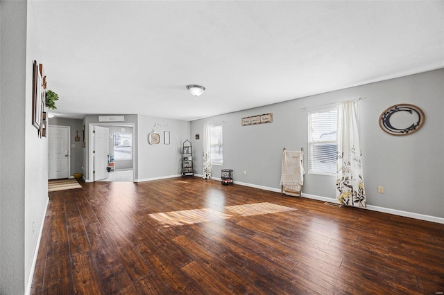 interior space with wood-type flooring and a healthy amount of sunlight