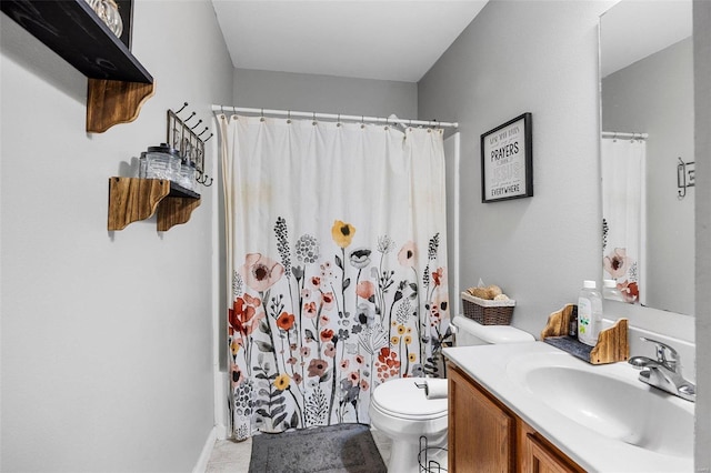 full bathroom featuring tile patterned flooring, vanity, toilet, and shower / tub combo with curtain