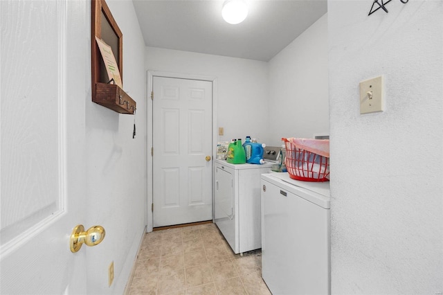 clothes washing area featuring washing machine and clothes dryer