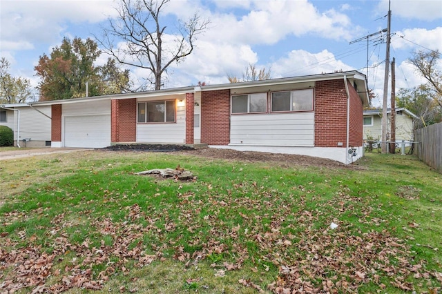 ranch-style home with a front lawn and a garage