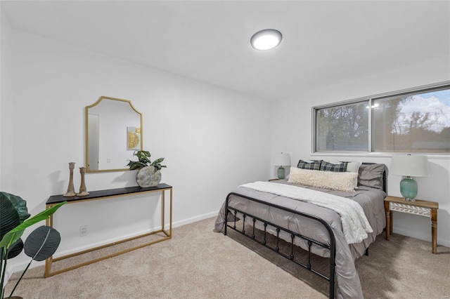 bedroom featuring light carpet