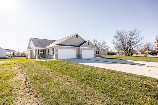 view of front of property with a garage and a front lawn