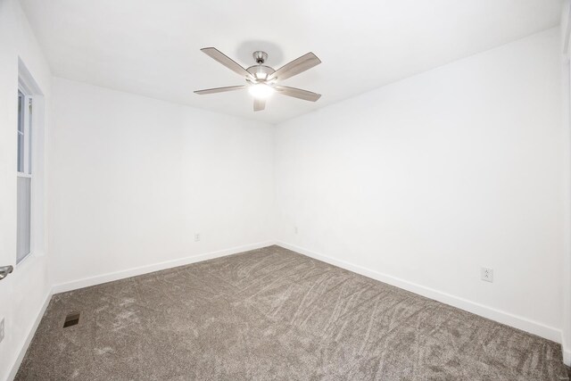 unfurnished room featuring carpet and ceiling fan