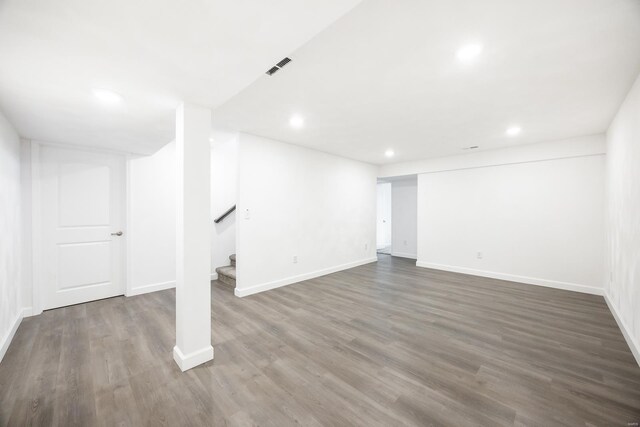 basement with dark wood-type flooring