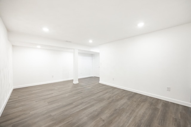 basement with dark wood-type flooring