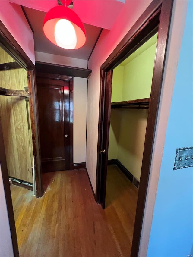 hallway featuring hardwood / wood-style flooring