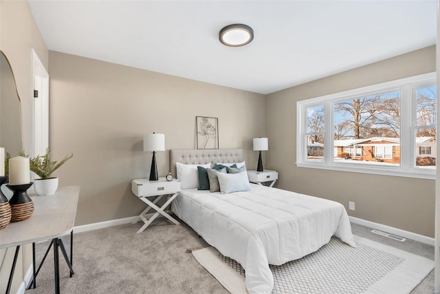 bedroom featuring light colored carpet