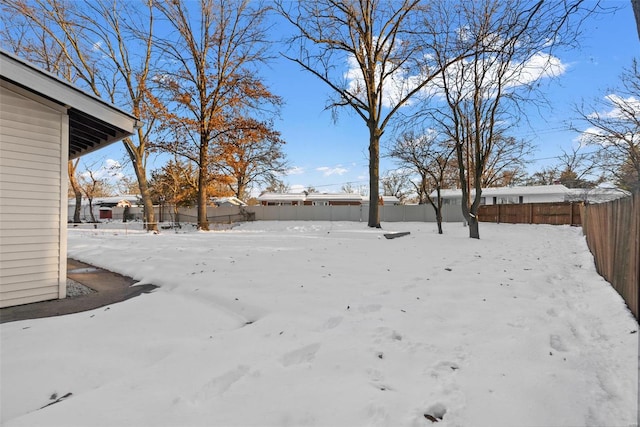 view of yard covered in snow