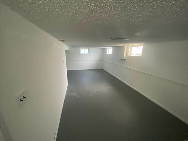 basement with a textured ceiling