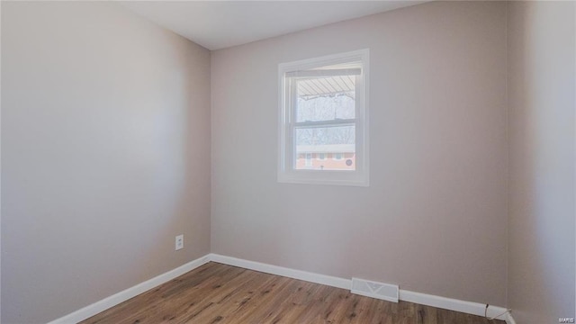 unfurnished room featuring hardwood / wood-style floors