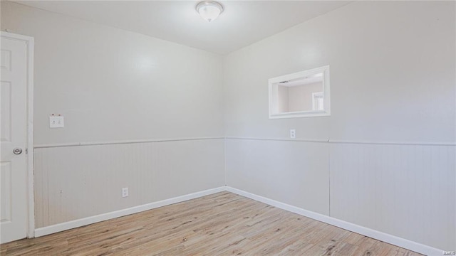 spare room featuring light hardwood / wood-style flooring