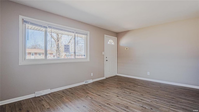 empty room with wood-type flooring