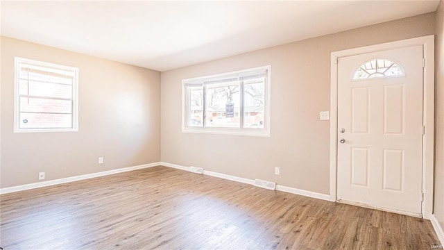 foyer with light wood-type flooring