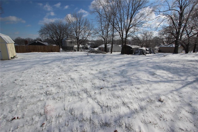 view of yard layered in snow