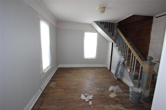 interior space with crown molding and wood-type flooring