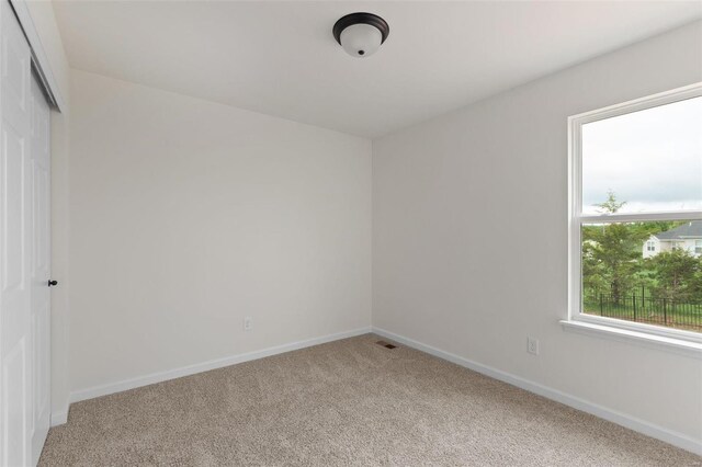 empty room featuring carpet flooring