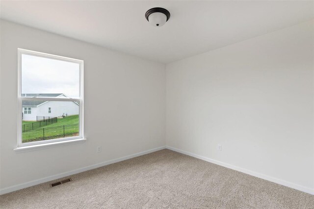 unfurnished room featuring carpet