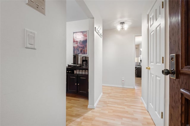 hall with light hardwood / wood-style flooring