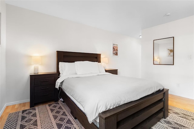 bedroom with wood-type flooring