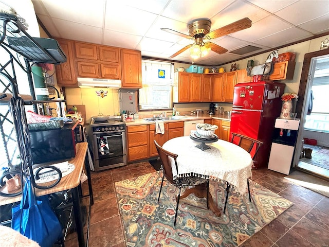 kitchen featuring refrigerator, a paneled ceiling, stainless steel stove, and white dishwasher