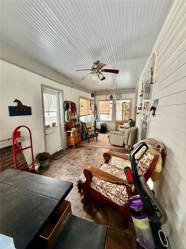 interior space featuring ceiling fan