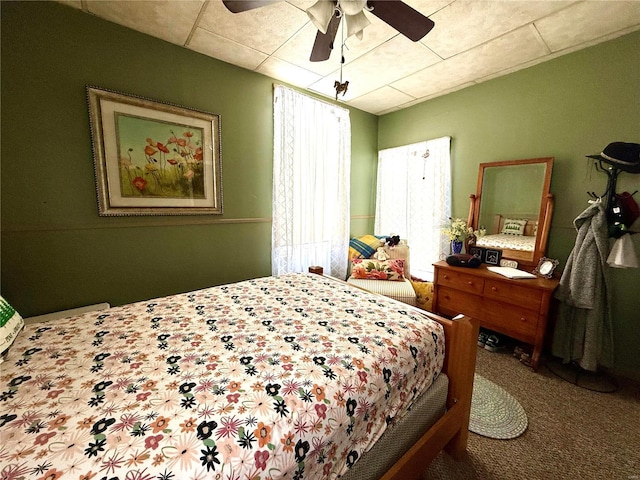 bedroom featuring ceiling fan and carpet floors