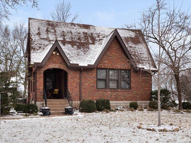 tudor home with brick siding