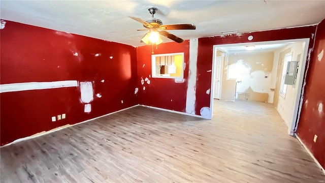 unfurnished room featuring hardwood / wood-style floors and ceiling fan