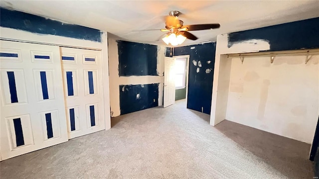 unfurnished bedroom featuring carpet and ceiling fan