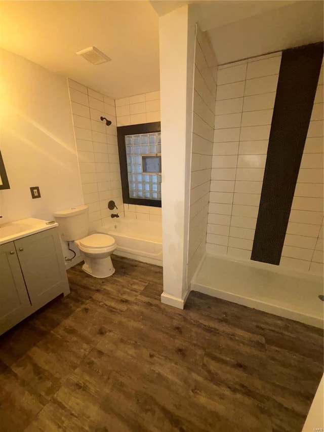 bathroom featuring hardwood / wood-style flooring, vanity, and toilet