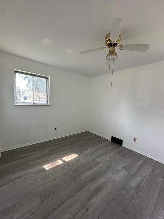 unfurnished room featuring ceiling fan and dark hardwood / wood-style flooring