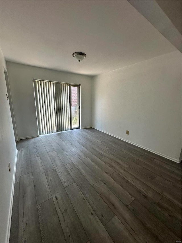 empty room featuring dark hardwood / wood-style floors